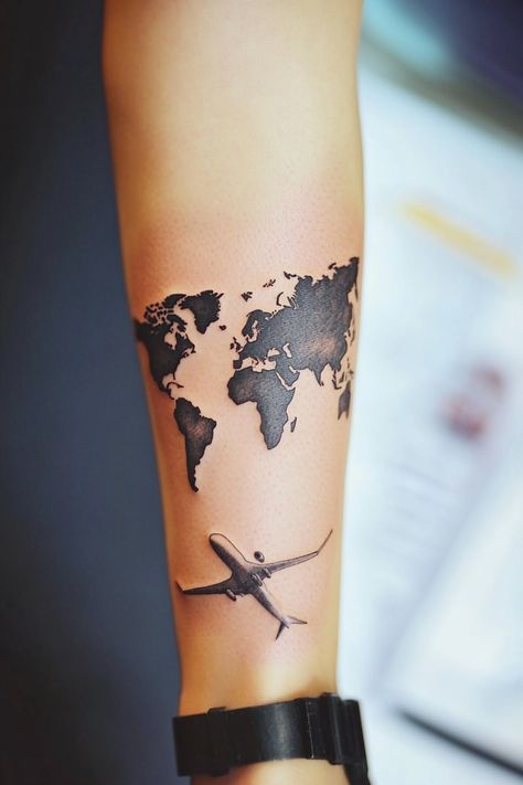 Forearm tattoo of a world map with an airplane underneath. Unique Women’s Tattoos, Travel Tattoos For Women, Travel Tattoo Ideas Unique, Travel Tattoo Ideas For Women, Travel Inspired Tattoos, Wanderlust Tattoos, Compass And Map Tattoo, Leg Band Tattoos, Travel Tattoo Ideas