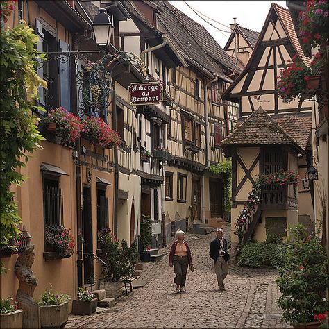 Paseo - n. 1. A leisurely stroll. 2. A place or path designed for walking. 3. A street or boulevard.      A.Word.A.Day (August 8, 2011) European Town, Cobblestone Street, German Houses, Alsace Lorraine, European Village, German Village, Medieval Village, Alsace France, Chateau France