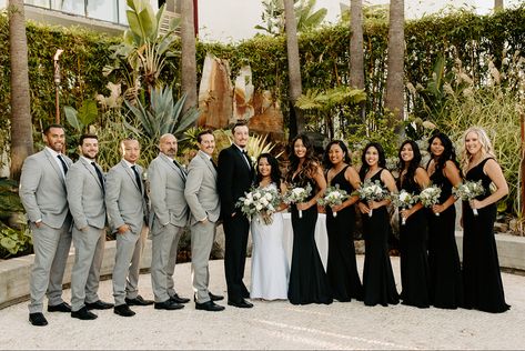 Groomsmen gray tuxedo and black bridesmaid dresses Wedding Party With Black Bridesmaid Dresses, Gray Suit Black Tie Wedding, Grey And Black Wedding Suit, Black Bridesmaid Dresses And Groomsmen, Black Gray Wedding Color Schemes, Black Bridal Party Attire Summer, Black Bridesmaids Dresses With Groomsmen, Black Bridesmaid Dresses Bridal Party, Black White Grey Wedding Theme