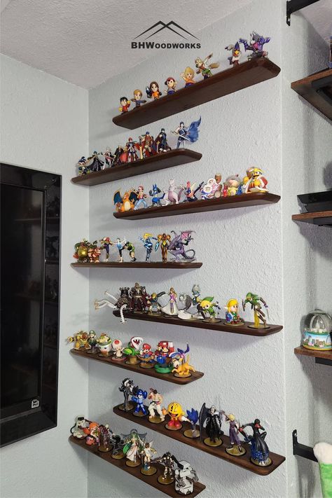 Elevate your gaming space with these solid Walnut floating shelves. Designed to take up as little room as possible while showcasing your Amiibo as much as possible! Each shelf holds 8 Amiibo figurines. #amiibodisplay #amiiboshelf #amiibofigurines #nintendoamiibo #amiibocollection #amiiboaccessories Floating Shelves Gaming Room, Amiibo Display, Walnut Floating Shelves, Gaming Space, Figurine Display, Figure Display, Nintendo Amiibo, Floating Shelf, Solid Walnut