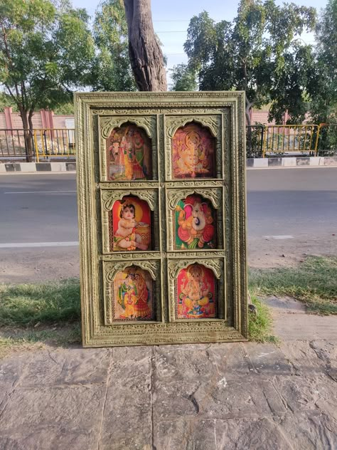 Hand carved wooden wall panel/ Carved wooden wall panel/ Indian carved wall panel/ Floral carved wall panel/ Indian furniture, Indian wall hanging.  This beautiful hand carved wooden wall panel has intrinsic designs carved into it by our skilled workers. This  panel has been made of mango wood and has clips behind to hang it on the wall. This wall panel can be use for mirror /photo/paintings.  We have fixed some print paintings in it only for an idea.  The panel has a distressed look to give it an antique vintage look. Size :-   6x4 feet  Weight :- Kg Region of Origin: India Primary Material: Wood Vintage Indian Interior Design, Pallet Furniture Outdoor Couch, Carved Wall Panel, Photo Paintings, Bedroom Concept, Mdf Art, Indian Wall Hanging, Indian Wall Decor, Artistic Room