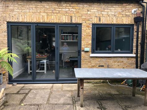 Fulham aluminium smart system bi folding doors with matching window in anthracite grey. Boom, what a job. #anthracite #bifolds #bifoldingdoors @wrightglazing 02086444224 Bifolding Doors Kitchen, Bi Folding Doors Kitchen, Anthracite Grey Windows, Bi Folding Doors, 1930s Semi, Kitchen Sliding Doors, Door Plans, Folding Windows, Oak Windows