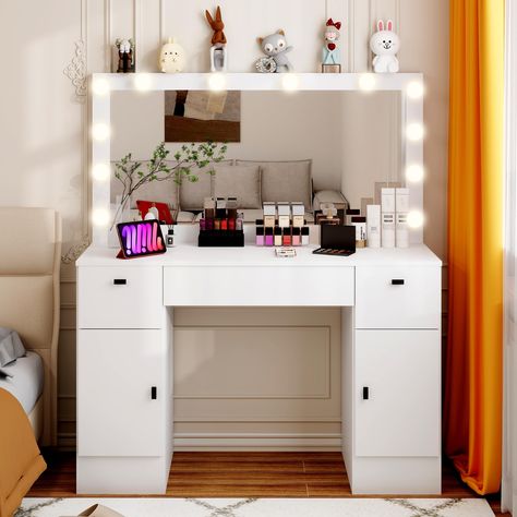 PRICES MAY VARY. 3 LIGHTING MODES & BRIGHTNESS ADJUSTABLE： This vanity mirror with lights equip with 12 LED bulbs, which can freely switch between three colors (cold, natural and warm). Brightness can also be adjusted using the controls on the back of the mirror.This provides a perfect match for your daily makeup. Skincare provides the atmosphere for appointments. VANITY DESK WITH CHARGING STATION：This dressing table has a built-in charging station, providing 2 standard jacks (125V 12A) and 2 US Storage Dressing Table, Lights Makeup, Vanity Desk With Mirror, Desk With Mirror, Dressing Table With Drawers, Cabinets Storage, Vanity Benches, Mirrored Vanity Desk, Bedroom White