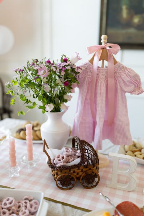 Low cost, low waste Baby Shower Decor ‣ hayden-interiors.com Baby In Bloom Girl Shower Decor, Baby Shower Sign In Table, Baby Shower Table Centerpieces Girl, Baby Clothesline Decoration, Baby Shoe Centerpiece Ideas, Baby Shower Ideas Pastel Colors, Thrifted Baby Shower Decor, Gold And Pink Baby Shower Ideas, French Garden Baby Shower Theme