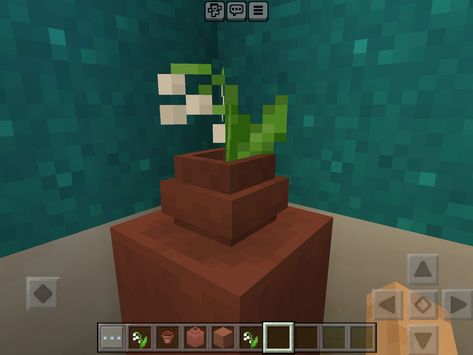 1. Place a large pot. 2. Place a pot into that pot (By clicking on the large pot) 3.Add a flower or a plant into the smaller pot. 4. Done! Large Pots, Flower Plant, 1 Place, A Flower, Flower Pots, Planting Flowers, Minecraft, Avatar, Plants