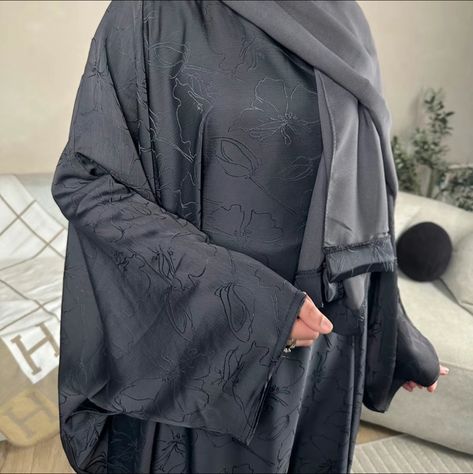 Introducing the Inayaat BATWING abaya (inner belt) - a perfect combination of style and comfort. This stunning abaya is designed with a batwing closed style, making it ideal for those who prefer loose-fitting clothing. The attached belt inside the abaya allows you to opt for a fitted look as well.Crafted from luxury printed zoom material, this abaya is perfect for any occasion. The lightweight and breathable fabric make it ideal for everyday wear, while its elegant design ensures you'll always look your best.The Inayaat BATWING comes with matching hijab to complete your outfit effortlessly, while its available colors of grey and black ensure that you can match it easily with your wardrobe.With its unique design and premium quality material, this batwing closed abaya is an excellent additio Kuwaiti Abaya Style, Printed Abaya Designs, Grey Abaya, Closed Abaya, Unique Abaya Designs, Pretty Abayas, Simple Hijab, Casual Hijab, Hijab Trends