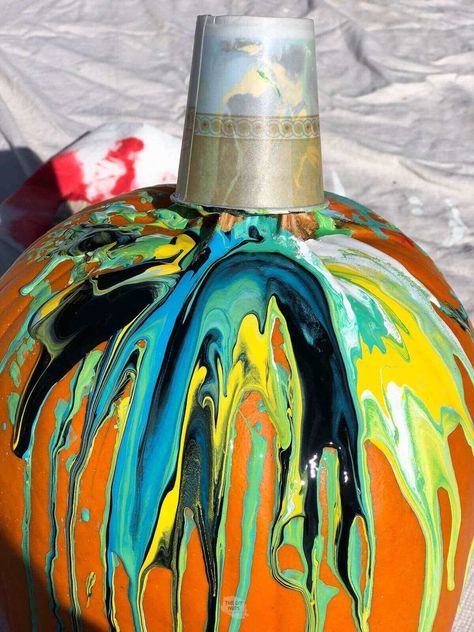 Are you looking for a fun way to paint pumpkins? This non-craving idea is a perfect family idea. Learn how to create a paint pour pumpkin with these simple steps. Complete this craft in 5 minutes of less. Paint Drip Pumpkins, Pumpkin Drip Painting, Acrylic Pour Pumpkin Painting, Pour Painting Pumpkins, Spray Painting Pumpkins, Pumpkin Paint Pour, Wicked Witch Pumpkin Painting, Pour Paint Pumpkins, Paint Pour Pumpkin