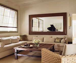 Horizontal mirror over couch echoes and reflects light from the window on the adjacent wall Long Mirror Behind Sofa, Mirror Above Tv Living Rooms, Large Mirror Wall Decor Living Rooms, Living Room Mirror Decor, Mirrors Above Sofa, Large Mirror Over Couch, Mirror Over Couch Ideas, Big Mirror Above Couch, Mirror On Living Room Wall