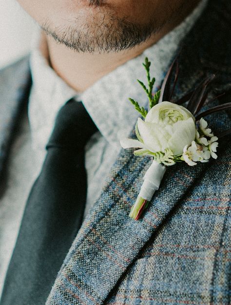 The simple magnetic grooms boutonniere features a single bloom of white ranunculus, white waxflower, cedar and agonis foliage.  #groomboutonniere #magneticboutonniere #boutonnieres #flowersbyjanie #whiteranunculus #calgaryweddings #calgaryweddingflorist #banffweddings #calgaryflorist #howtowearaboutonniere #whiteweddingflowers Men At Weddings, Spring Barn Wedding, Ranunculus Centerpiece, Antlers Photography, Ranunculus Wedding, Lace Bridal Shoes, Lace Bridal Dress, Rustic Farm Wedding, White Ranunculus