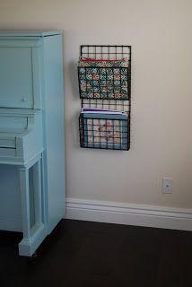 Apparently I'd hang it next my piano to hold music.That'll teach BC to insist I come up with a use for something BEFORE I buy it, right? Piano Nook, Piano Corner, Sheet Music Storage, Music Organization, Piano Music For Kids, Piano Music With Letters, Instrument Storage, Music Instruments Diy, Piano Wall