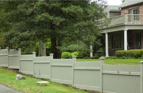 Our Custom Cedar Kennedy Straight, installed with the ‘stepping’ technique, creates beautiful synergy between the fence and the natural grade of the property. This customer opted to stain the wood a sage green to match the railing above the charming entryway.   The fence style, along with the unique installation method, beautifully frames this elegant, classic home.    (Also available in PVC)  Call 631-968-6828 for more information. Sage Green Fence, Charming Entryway, Green Fence, Fence Designs, Privacy Fence Designs, White Fence, Fence Styles, Fencing Companies, Cedar Fence