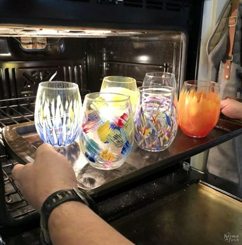 DIY Painted Wine Glasses | A great video tutorial for painting wine glasses the easy way | How to paint wine glasses | DIY painted Dollar Store glasses | DIY dishwasher safe hand painted tumblers | DIY painted wine glass ideas | How to paint glass the easy way | DIY painted glass ideas | Anthropologie knockoff painted glasses | #TheNavagePatch #easydiy #DIY #paintedglass #anthropologie #knockoff #DollarStore #Kidscrafts #HowTo #VideoTutorial #tutorial | TheNavagePatch.com Diy Stemless Wine Glasses Ideas, Paint Wine Glasses Diy, Diy Painted Wine Glasses, Christmas Wine Glasses Diy, Painted Wine Glasses Diy, Wine Glass Crafts Diy, Hand Painted Wine Glasses Diy, Painted Wine Glasses Christmas, Painted Tumblers