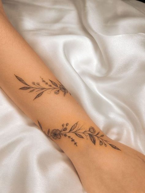 Simple Wrap Around Wrist Tattoos, Wrap Leaf Tattoo Arm, Wraparound Flower Tattoo, Wraparound Floral Tattoo, Carnation Wrap Around Tattoo, Wrap Around Tattoo With Butterflies, Dainty Floral Vine Tattoo, Wrist Vine Tattoos For Women, Birth Flower Vine Tattoos