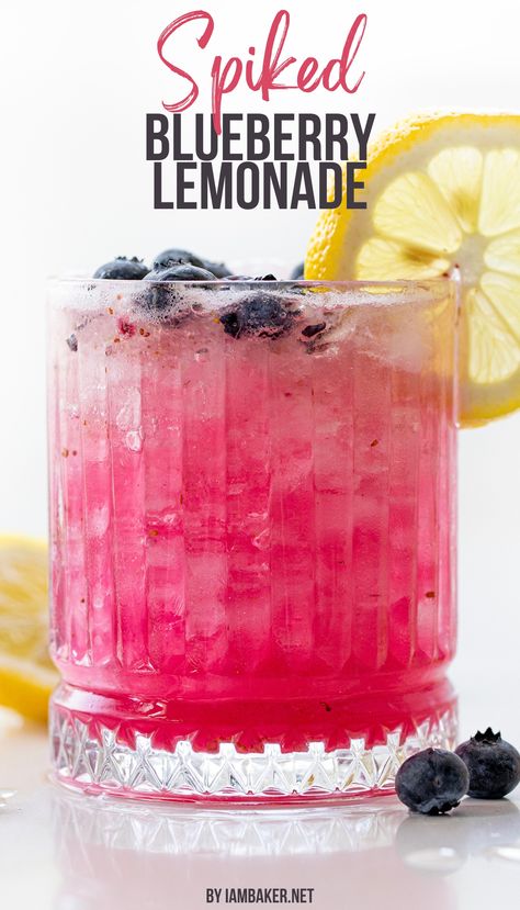 A glass full of spiked blueberry lemonade is shown, the glass is ornate, and has a lemon wheel on the edge and blueberries around it. This is all on a white counter. Blueberry Drink, Blueberry Drinks, Lemonade Juice, Lemonade Drink, Homemade Lemonade Recipes, Halloween Drinks Alcohol, Coctails Recipes, Blueberry Syrup, Blueberry Lemonade