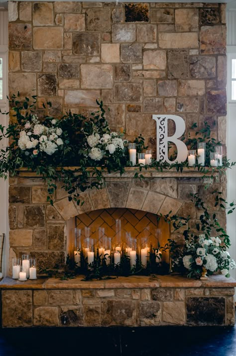 Romantic Sunday Wedding at Little River Farms | Milton, Georgia | Candles in wedding fireplace and lots of greenary and flowers Rustic Fireplace Wedding Decor, Sweetheart Table Wedding With Fireplace, Mantle Decor Wedding Fireplace, Fireplace Mantle Decor Wedding, Fireplace Decor Wedding Receptions, Fireplace Mantel Wedding Decor, Sweetheart Table In Front Of Fireplace, Wedding Photo Backdrop Ideas Receptions, Wedding In Front Of Fireplace