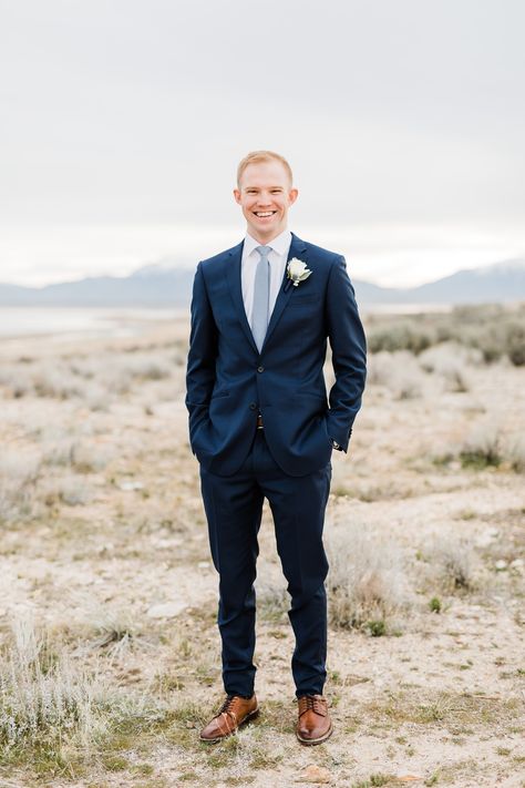 Groom with navy blue suit, light blue tie and brown shoes and belt  Dreamy Winter Bridal Session at Antelope Island || Utah Wedding Photographer || Syracuse, Utah || Photography by Tasha Rose Navy Suit Winter Wedding, Navy Blue Suit With Dusty Blue Tie, Navy Blue Suit With Brown Shoes, Navy Blue Suit Light Blue Tie, Navy Suit Brown Shoes Wedding, Navy Suit Dusty Blue Tie, Black Tux With Light Blue Tie, Ties With Navy Suits, Navy Suit With Blue Tie