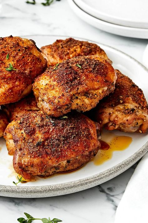 These crispy and juicy baked chicken thighs make for the perfect weeknight meal. They’re incredibly easy to make and packed with flavor! Crispy Chicken Thigh Recipes, Baked Chicken Thighs Bone In Skin On, Dark Meat Chicken Recipes, Chicken Thighs And Gravy, Baked Chicken Thighs Bone In, Baked Chicken Thighs Recipes, Boneless Chicken Thighs Recipes, Airline Chicken, Downshiftology Recipes