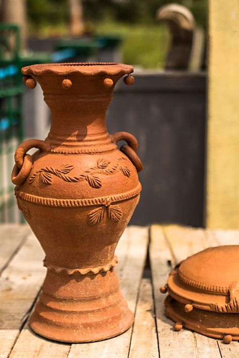 A decorated earthen pot. Object Drawings, Earthen Pots, Global Home, Object Drawing, Wooden Flowers, Ganesh Chaturthi, The Seasons, Radha Krishna, Ganesha