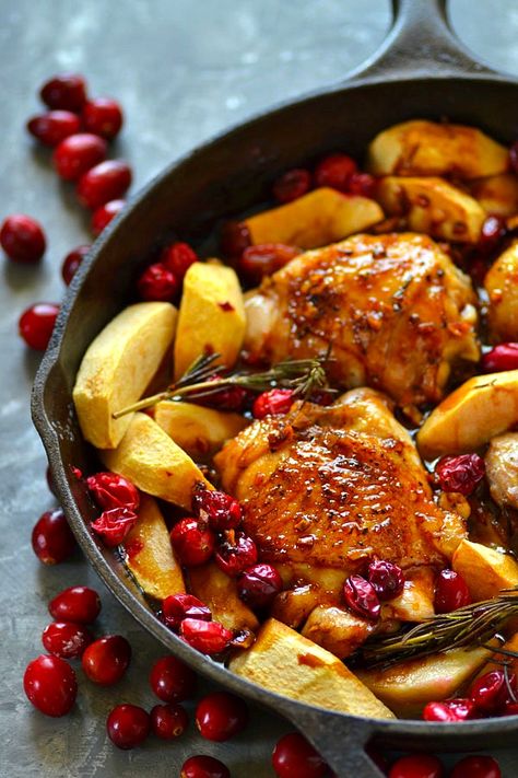 Juicy chicken thighs are roasted in tangy cranberries, soft apples, and covered in a sweet maple glaze for the EASIEST way to do chicken holiday-style! Soft Apples, Chicken With Apples, Maple Glazed Chicken, Juicy Chicken Thighs, Maple Chicken, Cranberry Chicken, Apple Chicken, Roasted Chicken Thighs, Cooking Healthy