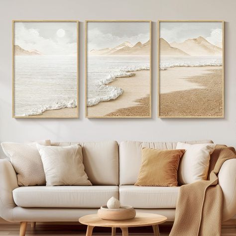 PRICES MAY VARY. [Framed Wall Art]: Set of 3 framed neutral coloured abstract beach wall art, each measuring 16x24 inches. Frames are made of durable, rust-resistant metal and finished in a natural wood colour to simulate the texture of real wood. [Canvas Artwork for Walls]: Our 2D prints artwork is made of waterproof canvas which is waterproof and easy to maintain. The canvas has a unique texture that enhances the visual effect of the image, saturates the colours, keeps the painting colourful f Modern Minimalist Coastal Decor, Calming Bedroom Artwork, Large Framed Canvas Wall Art, Coastal Living Room Wall Decor Ideas, Painting Ideas On Canvas 3 Piece, Above The Bed Artwork, Coastal Chic Home Decor, Picture Frames Above Couch, Behind Sofa Wall Decor