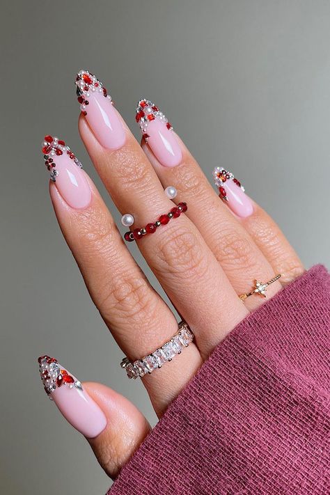 Gemstones Nail Design, Red Gemstone Nails, Rhinestone And Pearl Nails, Winter Nails With Gems, French Nails With Gems Rhinestones, Gem Christmas Nails, Jewel French Tip Nails, Pearl Christmas Nails, Christmas Nails Gems