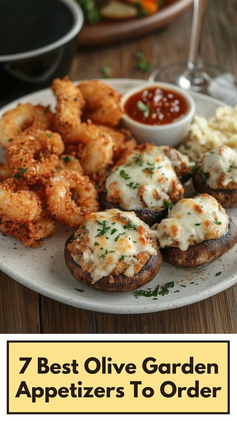 A plate of Olive Garden appetizers including crispy calamari and stuffed mushrooms served on a wooden table. Tour Of Italy Olive Garden Recipe, Stuffed Mushrooms With Crabmeat, Garden Appetizers, Olive Garden Appetizers, Olive Garden Stuffed Mushrooms, Delicious Starters, Crispy Calamari, Artichoke Appetizer, Dunstanburgh Castle