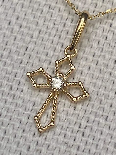 14K solid gold  cross genuine diamond pendant , 0.05 carats Include chain - 18 inches length  Height : 11.5 mm Width: 9.1 mm Total diamond weight: 0.05 carats  Diamond color: H2I Diamonds clarity ratings: SI1-SI2 Pendant Details Metal: 14K Yellow solid Gold - A good investment since 14K solid gold items hardly go down in value and in fact would go up in value long term. * It's a very flattering minimalist earring perfect for any occasion. Packing Each order will be beautifully packaged for gift giving in a jewelry box. Golden Cross, Gold Jewels Design, Gold Items, Minimalist Earring, Diamond Cross Pendants, Diamond Cross, Cross Jewelry, Gold Cross, Diamond Color