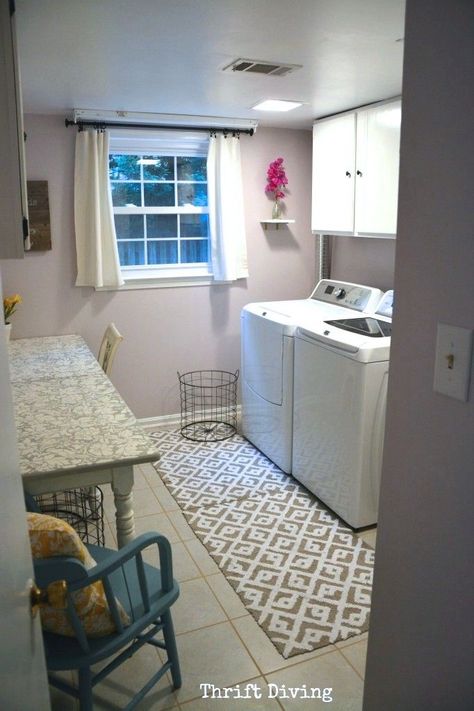 An old laundry room gets a fresh makeover! Walls: light lavender. Table: created by splitting a thrifted table in half and mounting it to the wall. Flooring: added SnapStone tiles right over top of the old vinyl. See the transformation! - Thrift Diving Lavender Laundry Room, Purple Laundry Room, Small Laundry Closet, Pink Laundry Rooms, Lavender Laundry, Lavender Room, Tiny Laundry Rooms, Basement Laundry Room, Basement Laundry