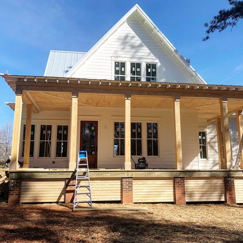 White farmhouse four gables house plan back porch and exterior painted White Dove Benjamin Moore Farmhouse Deck Skirting, Farmhouse Porch Furniture, Modern Farmhouse Deck, Four Gables House, Four Gables House Plan, Farmhouse Deck, Wood Skirting, Four Gables Farmhouse, Porch Skirting