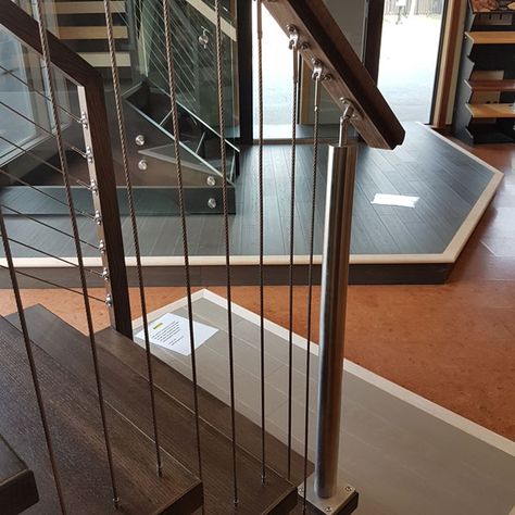 Metal Stair Railing Ideas, Vertical Iron Stair Railing, Vertical Cable Railing Interior, Wood Railing Metal Spindles, Farmhouse Cable Stair Railing, Metal Cable Stair Railing, Stair Railing Design Glass And Wood, Vertical Cable Railing, Vertical Cable Stair Railing