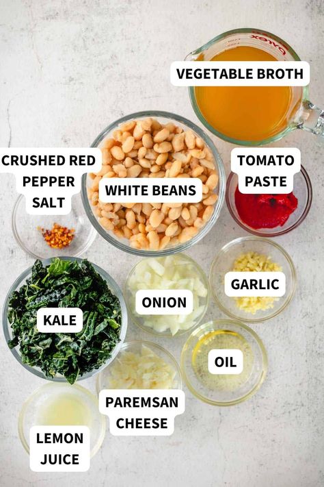 This White Beans and Greens with tomato and kale has to be one of the best 30-minute meals out there. And you only need one pan to make it. Use any type of white bean you have on hand—great northern, cannellini, and navy beans all work well. Combine the beans, kale, tomato sauce, and cheese all in one skillet and serve with your favorite fresh bread for dipping. It's like comfort food heaven! Canneli Beans, Saucy Beans, White Beans And Greens, White Beans And Kale, Navy Bean Recipes, Canellini Beans, Kale And White Bean, Pecan Treats, Bread For Dipping