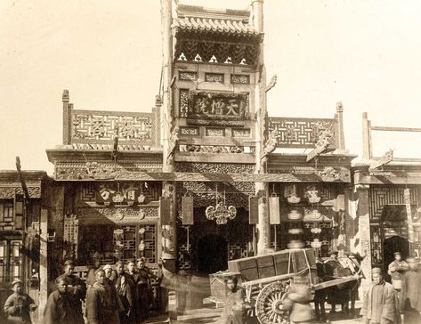 A view of a street scene in front of an ornate wooden tobacco shop in the quarter of Peking known as the Chinese City. Lost Technology, Chinese Cities, Chinese City, Imperial China, Moon Gate, Rare Historical Photos, Air Element, Kunming, Great Wall Of China