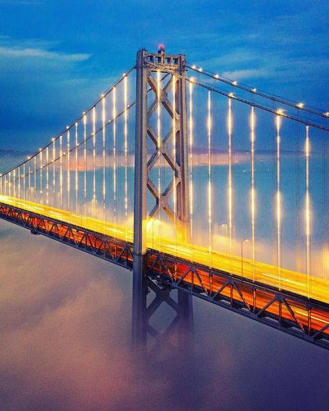 Daniel Berson on Instagram: "“Below the Deck” The San Francisco-Oakland Bay Bridge rises above a low wispy fog on a cold winter evening. The bridge rising out of the mist is one of my favorite images. Low fog predicted by the sunset scientists @ig_escaype January 3, 2021 DJI Mavic Pro 2 ISO 200, f/3.5, 2sec #karlthefog #bayareafog #sanfranciscofog #lowfog #lfe #sanfrancisco #sfbaybridge #sanfranciscobaybridge #baybridge #sfgate #wildbayarea #wildcalifornia #streetsofsanfrancisco #street Bay Bridge San Francisco, Winter Evening, Dji Mavic Pro, Mavic Pro, January 3, The Mist, My Favorite Image, Bay Bridge, The Sunset