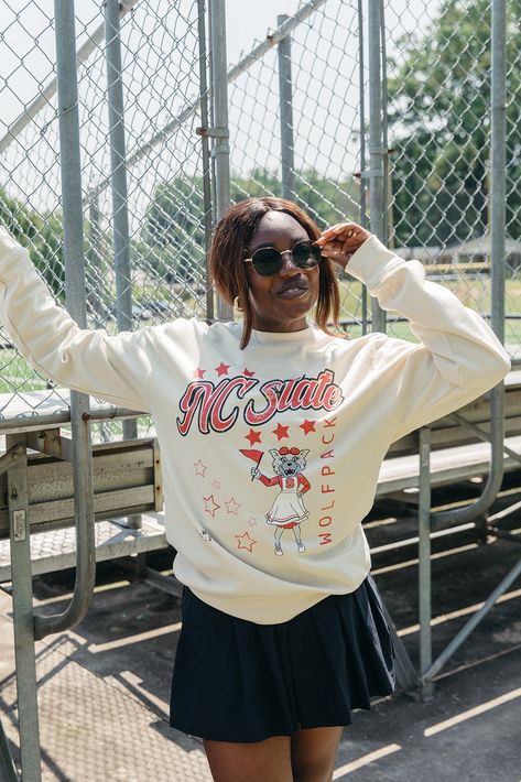 We've been loving ALL things vintage! ✨️ Of course, we had to create a vintage NC State sweatshirt for all things game day! & if you missed it... we just dropped the cutest NC State collab! 😉❤️ College Crewneck Outfit, Crewneck Outfit, College Crewneck, Nc State University, Girl Tribe, Vanilla Milkshake, University Outfit, Nc State, Graphic Apparel