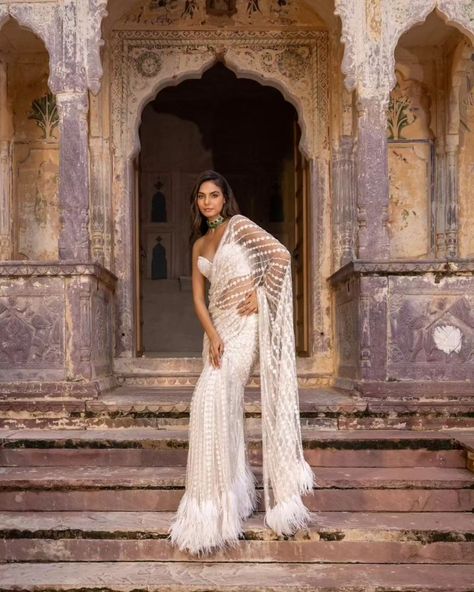 Pre-pleated sarees are Bae❤️! Add just enough drama with the Sasha saree, those feathers at the skirt bottom and pallu with the shoulder cape are *chefs kiss 🤌🏼* and that Corset blouse - cherry on the top SASHA - Ivory saree hand embroidered with sequins and pearls with a hint of crystals and dainty feather detailing. Cosmos: A Cocktail Affair Discover the collection: Online at Roujeofficial.com via link in bio Calcutta | Hyderabad Jewelry:@pctandsons [ Roujeofficial, rouje, Cosm... Reception Outfit Bridesmaid, Ivory Saree, Pleated Saree, Sequence Saree, Sequin Saree, Shoulder Cape, Corset Blouse, Chefs Kiss, Wedding Costumes