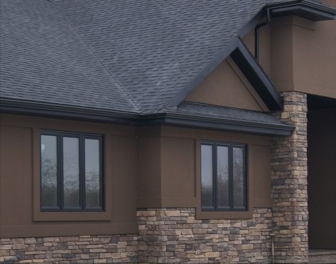 Brown And Black Exterior House Colors, Modern Brown House Exterior, Brown And Gray House Exterior, Dark Brown Stucco House Exterior, Dark Brown Siding House Color Schemes, Chocolate Brown Exterior House Colors, Dark Brown Houses, Brown Stucco House Exterior, Dark House Exterior Colors