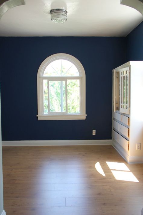 Awesome room makeover (paint and new floors)  - by Emily Henderson Loyal Blue Paint, Sw Loyal Blue, Royal Blue Sherwin Williams, Sherwin Williams Loyal Blue, Royal Blue Wall Paint, Royal Blue Room, Ikea Flooring, Royal Blue Walls, Bedroom Tv Wall