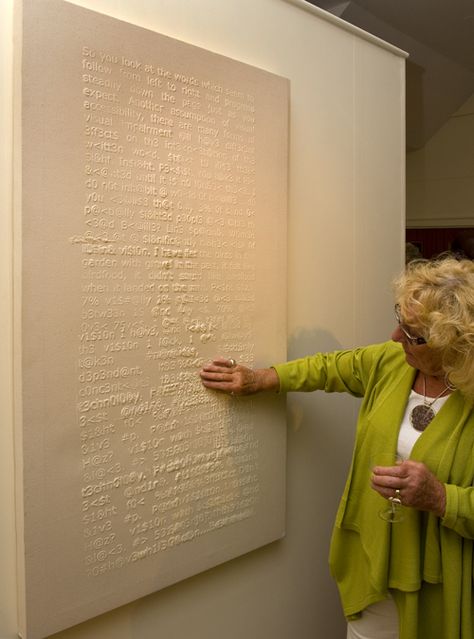 Tactile art. Image description: a woman in a gallery is touching the surface of a large white canvas, which has words and symbols in tactile raised print. Visible And Invisible Identity Portraits, Tactile Art For The Blind, Tactile Transducers, Interactive Textile Installation, Participatory Art Installation, Blind Art, Tactile Art, Alphabet Symbols, Tumblr Art