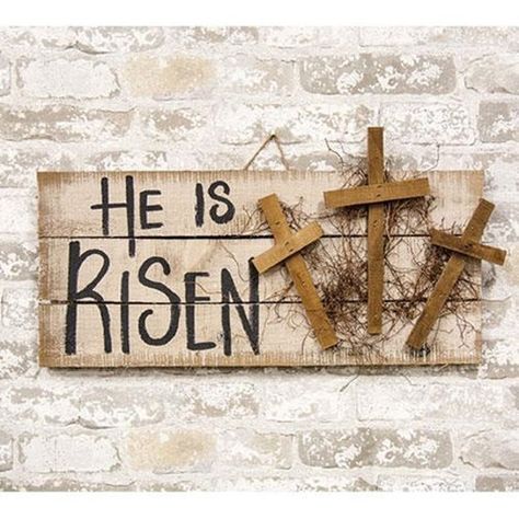 "He Is Risen Hanging Pallet Sign with Crosses is a wooden slat sign with a painted and distressed tan finish. Sign reads, \"He is Risen\" in black text and it is accented by three wooden crosses and dried vine. It comes ready to hang by a jute rope installed at the back and it looks great on a covered porch, in an entryway, or hung above a mantel. Measures 13\" high by 24\" wide by 2\" deep." Wooden Cross Crafts, Easter Crafts For Adults, Easter Wood Crafts, Easter Craft Decorations, Wooden Crosses, Christian Crafts, Cross Crafts, Spring Easter Crafts, Easter Bunny Crafts