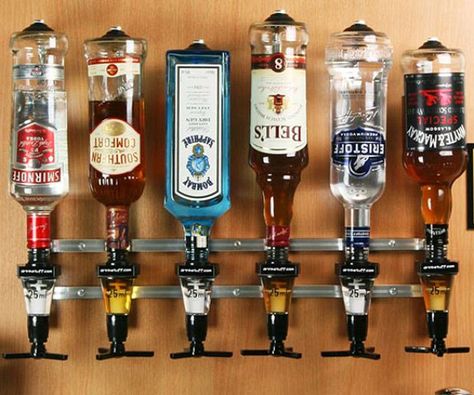 Give your home bar the look and feel of a fancy watering hole by serving your drinks with the rack and pour liquor dispensers. Perfect for bars that are tight on space, it allows you to store bottles in a manner that keeps them handy and ready to serve at all times. Wine Dispenser, Ultimate Man Cave, Liquor Dispenser, Man Cave Basement, Man Cave Home Bar, Bar Wall, Bar Room, Man Cave Bar, Basement Bar