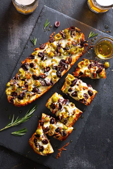 This deliciously simple olive cheese bread looks a lot more complicated than it is. That makes it the perfect appetizer for your next dinner party. Just top your bread with the ingredients, bake it, and grab a slice before it’s gone. Olive Cheese Bread, Bread Photography, Stuffed Breads, Dinner Party Appetizers, Olive Bread, Olive Recipes, Spain Food, Club Sandwich, Cheese Bread