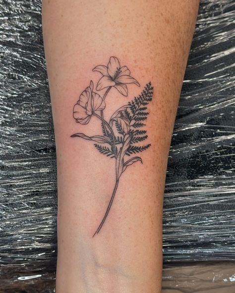 Beautiful custom fineline floral arrangement for my clients first tattoo! Finger for scale, for her daughters petal, Lily, and fern!! #fineline #dainty #beautifultattoo #customtatto #customarrangements #finelinetattoo Fern Finger Tattoo, Micro Realism, Violet Tattoo, Tattoo Finger, Fern Tattoo, Tattoo Convention, Glitter Tattoo, Line Work Tattoo, Line Work