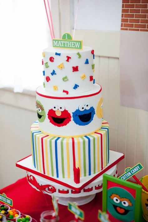 Sesame Street themed 1st birthday party via Kara's Party Ideas KarasPartyIdeas.com Invitation, cake, food, supplies, recipes, and MORE! #sesamestreet #sesamestreetparty (40) Sesame Street Birthday Party Ideas Boy, Elmo Birthday Party Boy, Sesame Street Birthday Cakes, Birthday Cake Kids Boys, Elmo Birthday Cake, Sesame Street Birthday Party Ideas, Sesame Street Cake, Kids Birthday Party Food, Elmo Cake