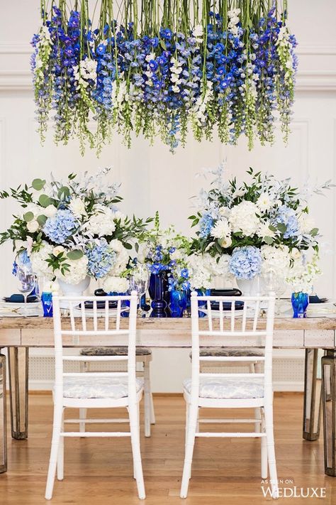 Short centrepieces don’t get in the way of dinner conversation, but often mean sacrificing a few flowers. With this low-hanging chandelier of blue bells, your dinner guests get the best of both worlds. | Photography By: Denise Lin Photography. | WedLuxe Magazine | #wedding #luxury #weddinginspiration #luxurywedding #centrepiece #floral #floralarrangement #flowers #tablescape Wedding Reception Dinner, Blue Wedding Inspiration, Wedding Reception Flowers, Royal Blue Wedding, Reception Dinner, Blue Wedding Flowers, Reception Flowers, Porcelain Blue, Salou