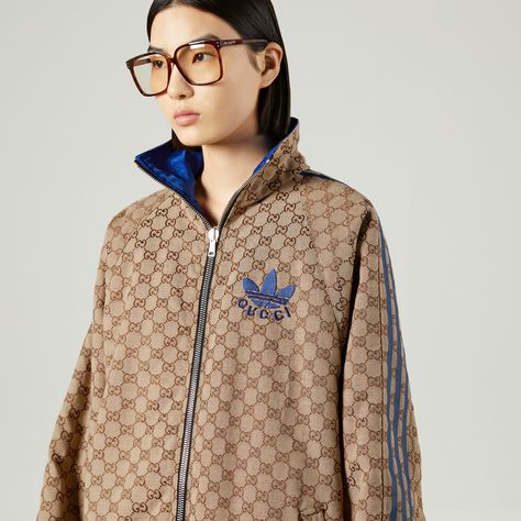 Shop the adidas x Gucci GG canvas reversible bomber in beige at GUCCI.COM. Enjoy Free Shipping and Complimentary Gift Wrapping. Adidas X Gucci, Gucci X Adidas, Adidas Gucci, Gucci Adidas, Designer Outerwear, Gucci Coat, Canvas Jacket, Gucci Tote, Fire Fits