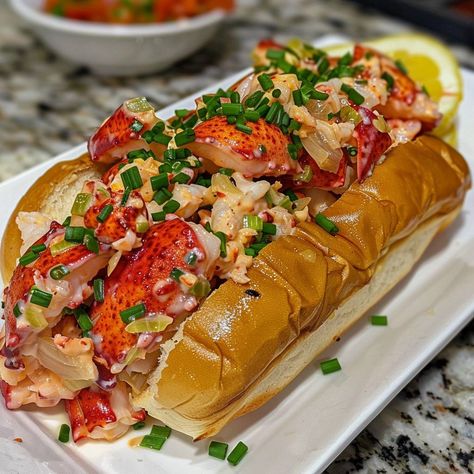 🦞🌊 Dive into the taste of the coast with a classic Maine Lobster Roll! #LobsterRoll #SeafoodDelight 🍽️ Maine Lobster Roll 🛒 Ingredients: 4 fresh lobster tails (about 450 grams of lobster meat) 4 New England-style hot dog buns 2 tablespoons mayonnaise 1 tablespoon lemon juice 2 celery stalks, finely chopped Salt and black pepper to taste Butter for toasting Chives for garnish 👩‍🍳 Instructions: Cook Lobster: Boil lobster tails for about 8 minutes. Cool, then chop meat. Mix: Combine lobster ... Boil Lobster Tail, Maine Lobster Roll, Cook Lobster, Lobster Boil, Fresh Lobster, Instagram Recipes, How To Cook Lobster, Lobster Meat, Twisted Recipes