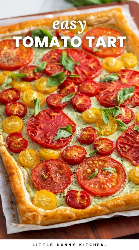 This easy and beautiful Tomato Tart is topped with herbed ricotta cheese and juicy tomatoes. Made with puff pastry, it's ready in under 40 minutes. Tomato Tart Puff Pastry Feta, Tomato Tart With Ricotta, Ricotta And Tomato Recipes, Quiche Tart Recipes, Tomato Pie Crescent Rolls, Ina Garden Tomato Tart, Tomato Ricotta Puff Pastry Tart, Tomato Tart Puff Pastry Ricotta, Puff Pastry Tomato Tart Recipe