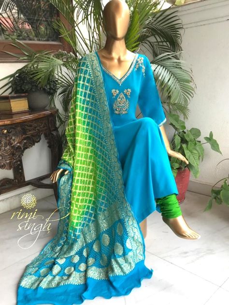 “I believe that if one always looked at the skies, one would end up with wings.”   Blue pure crepe kurta with hand embroidery on the neckline and sleeve edge paired with a green satin lycra churidaar and double shaded pure georgette dupatta with zari and rai bandhani.  Available exclusively at  Rimi Singh Studio A 999 Sushant Lok 1  Gurgaon  #9818310054. Anarkali Dress With Bandhani Dupatta, Bandhani Dupatta Suits, Celebrity Suits, Bandhani Dupatta, Indian Sari Dress, Bandhani Dress, Heavy Dresses, Anarkali Dress Pattern, Punjabi Outfits