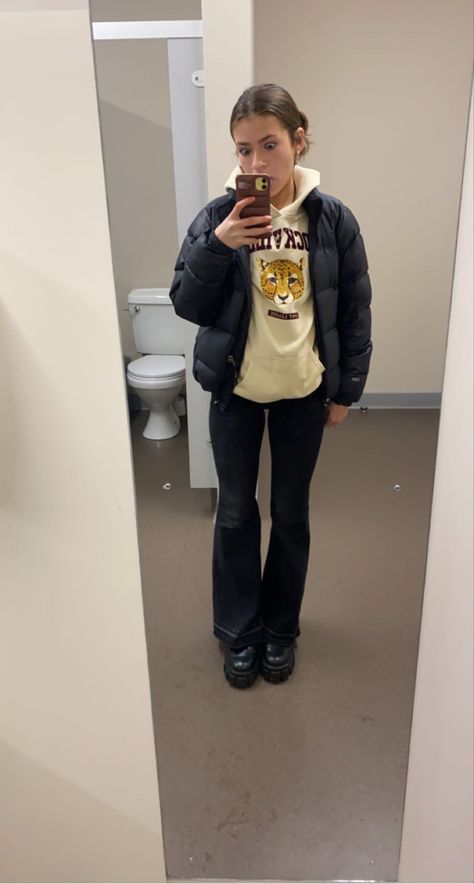 Mirror selfie of a girl wearing a north face puffer jacket with a beige hoodie underneath as well as black bootleg pants and black boots Bootleg Pants Outfit, Bootleg Jeans Outfit Winter, Black Bootleg Jeans Outfit, Staple Clothing Pieces, Bootleg Jeans Outfit, Black Puffer Outfit, North Face Puffer Outfit, Puffer Outfits, Mule Outfit