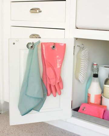 The insides of cabinets are also great places to put hooks for rags, gloves, and pot holders. | 27 Lifehacks For Your Tiny Kitchen Under The Sink Organization, Martha Stewart Home, Mini Loft, Organisation Hacks, Kitchen Hacks Organization, Sink Organizer, Under Sink, Tiny Kitchen, Cleaning Organizing